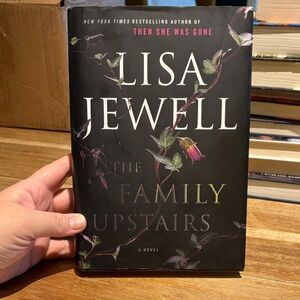 The Family Upstairs - Black & Purple Hardcover Novel